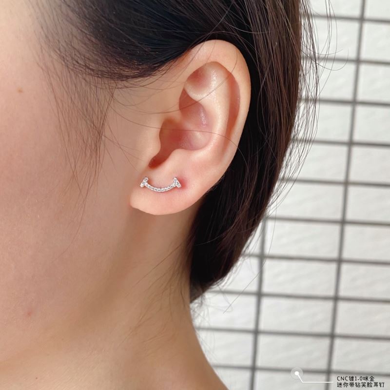 T*f*ny earrings